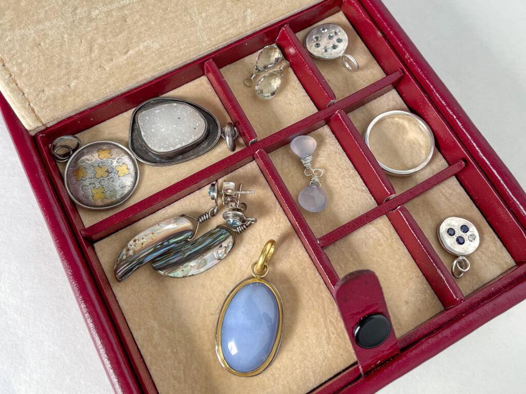Red travel jewelry bento box with summer jewelry set inside