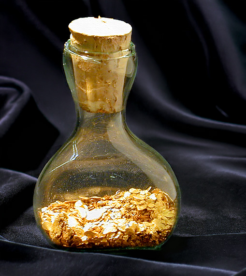Fairmined mercury free gold flakes in a flask