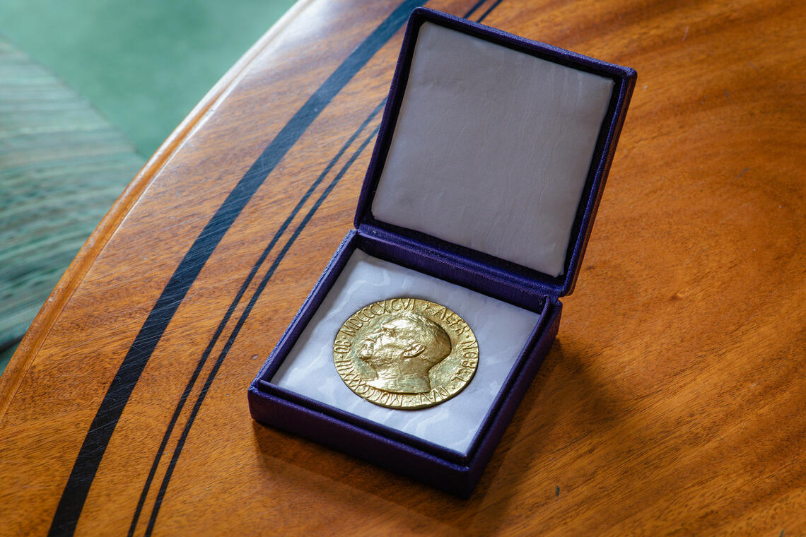 Nobel prize in presentation box on table